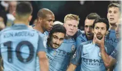  ??  ?? Manchester City midfielder Ilkay Gundogan (3rd left) celebrates scoring his team’s third goal during yesterday’s Champions League Group C match against Barcelona at the Etihad Stadium. – AFPPIX