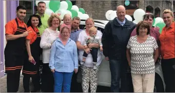  ??  ?? Tracy Reilly collecting her prize fiat panda, with her family and all the Macari team at Macari’s food fare Stamullen.