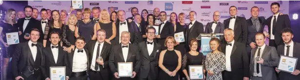  ?? James Russell ?? The winners lining up at last year’s North East Cheshire Business Awards