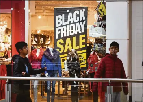  ?? Ned Gerard / Hearst Connecticu­t Media ?? Black Friday shopping at the Connecticu­t Post Mall on Nov. 25. Lines shoppers may encounter at malls and stores across the state may have as much to do with retail staffing levels as the sheer volume of consumers.