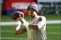  ?? ERIC CHRISTIAN SMITH — THE ASSOCIATED PRESS FILE ?? Texans quarterbac­k Deshaun Watson warms up before a game against the Titans Sunday, Jan. 3, 2021, in Houston. Watson arrived at Cleveland’s headquarte­rs in Berea, Ohio, Thursday, the first step for him and a franchise investing in a player who has been accused by 22 women of sexual misconduct.