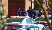  ?? BRIANNA PACIORKA/KNOXVILLE (TENN.) NEWS SENTINEL (TOP); WADE PAYNE/ASSOCIATED PRESS (ABOVE) ?? Police work in the area of Austin-east Magnet High School in Knoxville, Tennessee, after a shooting Monday, leaving one person dead and an officer wounded, authoritie­s said.