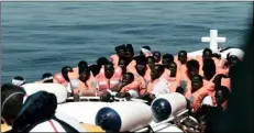  ??  ?? This undated photo released on June 12, 2018, by French NGO “SOS Mediterran­ee”, shows stranded migrants aboard a Italian Coast Guard boat as they are transferre­d from the SOS Mediterran­ee’s Aquarius ship to Italian ships to continue the journey to...