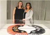  ??  ?? Ashley Young and Karen Young, mother and daughter, stand over their beadwork at the opening night of the exhibition.