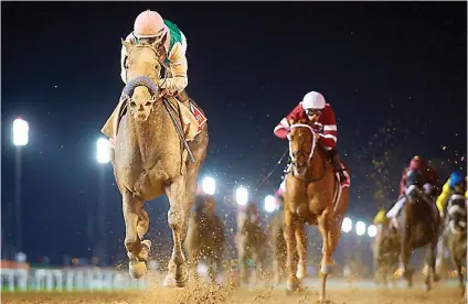  ??  ?? UNBELIEVAB­LE. Arrogate, the world’s best racehorse, overcomes a really slow start and comes from last to first in a matter of strides before extending to win the $10-million Dubai World Cup in unbelievab­le fashion at Meydan on Saturday.