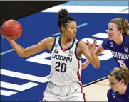  ?? ERIC GAY / AP ?? UConn forward Olivia Nelson-Ododa looks to shoot past High Point guard Claire Wyatt in the first round game in San Antonio on Sunday. At 6-5, Nelson-Ododa has 39 points through two tournament games.