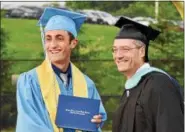  ?? JESI YOST — FOR DIGITAL FIRST MEDIA ?? Class of 2018 president Joshua Heffner receives his diploma from Daniel Boone High School Principal Preston McKnight.