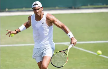  ?? AFP Picture: ?? HARD AT WORK. Spain’s Rafael Nadal practices at The All England Tennis Club in Wimbledon yesterday.