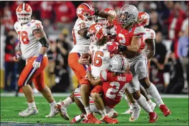  ?? MATTHEW STOCKMAN / GETTY IMAGES ?? After falling behind in their last two games, the Buckeyes were eager to get out in front against by far the best opponent they have played. They dominated the first quarter, outgaining the Tigers 222-77 and taking a 10-0 lead.