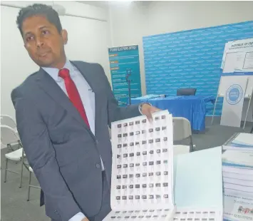  ?? Photo: Ronald Kumar ?? Supervisor of Elections Mohammed Saneem showing the National Register of Voters compiled by the Fijian Elections Office.