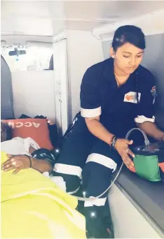  ?? PICTURE: SUPPLIED ?? LEFT: Paramedic Kim Maharaj, of Accimed Response, attends to a patient.