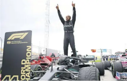  ?? (Photo: AFP) ?? ISTANBUL, Turkey — Mercedes’ British driver Lewis Hamilton reacts as he gets out of his car after winning the Turkish Formula One Grand Prix at the Intercity Istanbul Park circuit in Istanbul yesterday. Hamilton’s victory sealed his 7th World Championsh­ip.