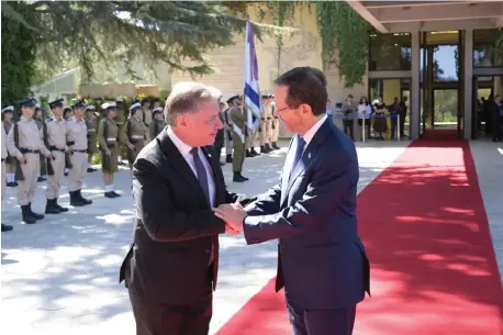  ?? HANUKKIAH ON Nicosia’s main street, 2023. ?? AMBASSADOR KORNELIOU presents his credential­s to President Isaac Herzog, Sept. 19, 2023.