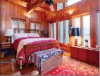  ?? ?? The additional bedroom offers a vaulted wood beamed ceiling and eight windows.