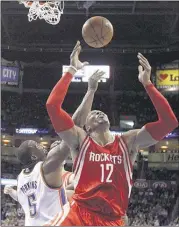  ?? SUE OGROCKI / ASSOCIATED PRESS ?? Dwight Howard had 12 points and nine rebounds and the Houston Rockets got past Kendrick Perkins and the Oklahoma City Thunder despite shooting 28.8 percent from the field.