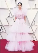  ??  ?? Country music sensation Kacey Musgraves made a major statement in a Giambattis­ta Valli gown that looked as sweet as spun sugar.