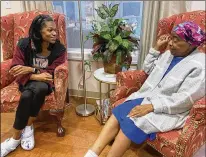  ?? AMANDA KING/AUGUSTA CHRONICLE ?? Lindsay Ambush (left) and her mother, Sandra Hall, relax in the library of The Lydia Project house in Augusta. The two, who live in Ridgeway, South Carolina, are staying at the home while Hall receives treatment at the Georgia Cancer Center.