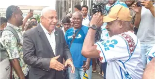  ?? AFP PHOTO ?? NO JAIL TERM
Fiji’s former prime minister Frank Bainimaram­a meets supporters as he leaves the Magistrate­s Court in Suva on Thursday, March 28, 2024.