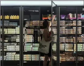  ?? HIROKO MASUIKE — NEW YORK TIMES FILE ?? A shopper at a grocery store in Manhattan in August 2022. Gains in salary and the job market have been overwhelme­d by rising prices.