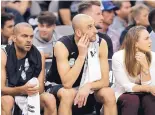  ?? ERIC GAY/ASSOCIATED PRESS ?? Without coach Gregg Popovich, the Spurs look on forlornly during their loss to Golden State on Thursday. From left are Tony Parker, Manu Ginobili and assistant coach Becky Hammon.