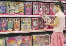  ?? MA R K R A L S T O N / A F P/ G E T T Y I MAG E S ?? Privacy advocates are concerned that Mattel’s interactiv­e, Internetco­nnected doll Hello Barbie could be used to unfairly market to children.
