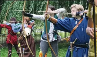  ??  ?? ON TARGET: Young archers at the JORVIK festival. Right: Singer Sophie Ellis-Bextor