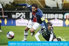  ?? —AFP ?? ANGERS: Paris Saint-Germain’s Brazilian defender Marquinhos (left) runs with the ball during the French L1 football match between Angers (SCO) and Paris Saint-Germain (PSG) at the Raymond Kopa Stadium in Angers, western France, on Saturday.