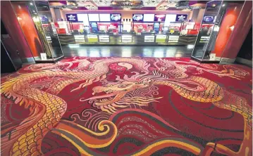  ??  ?? A dragon motif on the carpet in the lobby of the TCL Chinese Theatre in Hollywood.