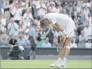  ??  ?? Sebastian Korda reacts after winning a men’s singles third-round match against Daniel Evans at the Wimbledon Championsh­ips in London on Friday.