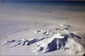  ??  ?? Part of the eastern flank of Crosson Ice Shelf (centre left) and Mount Murphy (foreground) as viewed during a NASA IceBridge flight in 2012. Thwaites Ice Shelf lies beyond the highly fractured expanse of ice (centre).