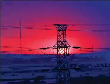  ?? HONG MENEA ?? The sun sets behind a high voltage transmissi­on tower in Phnom Penh’s Meanchey district.