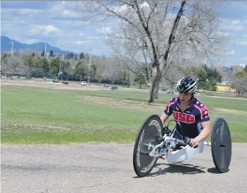  ?? P. SOLOMON BANDA/THE ASSOCIATED PRESS ?? Paralympia­n Oksana Masters rides her hand-cycle during training in Colorado Springs, Colo. Masters was adopted out of a Ukrainian orphanage nearly two decades ago.