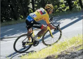  ?? PETER DEJONG — THE ASSOCIATED PRESS ?? Belgium’s Greg van Avermaet, wearing the overall leader’s yellow jersey, speeds downhill during the tenth stage of the Tour de France cycling race over 158.8 kilometers (98.7 miles) with start in Annecy and finish in Le Grand-Bornand, France, Tuesday.