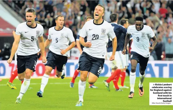  ?? Mike Hewitt/Getty Images ?? Rickie Lambert celebrates scoring for England against Scotland with his first touch in internatio­nal
football