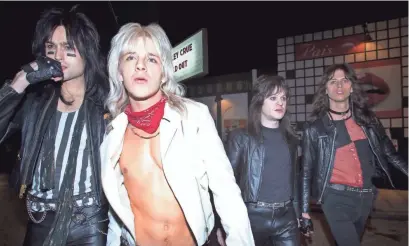  ?? JAKE GILES NETTER/NETFLIX ?? Motley Crue bandmates Nikki Sixx (Douglas Booth, left), Vince Neil (Daniel Webber), Mick Mars (Iwan Rheon) and Tommy Lee (Colson Baker) own the L.A. rock scene in “The Dirt.”