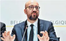  ?? FOTO:AFP ?? Premiermin­ister Charles Michel bei einer Pressekonf­erenz am Sonntag. Er will nun mit einer Minderheit­sregierung weitermach­en.