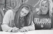  ?? [PHOTO BY CHRIS LANDSBERGE­R, THE OKLAHOMAN] ?? Carl Albert’s Audrie LaValley signed a national letter of intent to play softball with the Sooners on Wednesday.