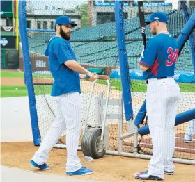  ??  ?? Jake Arrieta y Jon Lester (abridor de hoy), en la práctica del jueves.