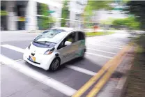  ?? YONG TECK LIM/ASSOCIATED PRESS ?? An autonomous vehicle is test-driven in Singapore on Wednesday. Actual self-driving taxi service kicked off on Thursday, with six vehicles to start.