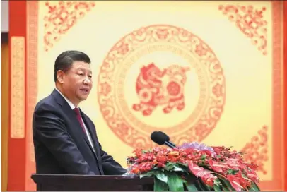  ?? JU PENG / XINHUA ?? President Xi Jinping delivers a speech on Sunday at a gathering at the Great Hall of the People in Beijing in which he spoke of China’s achievemen­ts in the past year and extended Spring Festival greetings to all Chinese at home and abroad.