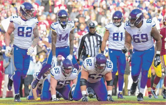  ?? | GETTY IMAGES ?? The Vikings played leapfrog to celebrate a second- quarter touchdown catch by wide receiver Adam Thielen ( 19), who had eight receptions for 166 yards Sunday.