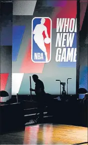  ?? AP ?? ■
A man works inside the ESPN Wide World of Sports Complex on Wednesday ahead of the NBA restart on Thursday.