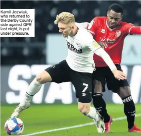  ??  ?? Kamil Jozwiak, who returned to the Derby County side against QPR last night, is put under pressure.