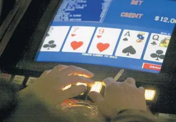  ?? CATHLEEN ALLISON/AP 2005 ?? Video poker began in the 1970s when William Redd — known as the “King of Video Poker” — married video game technology with gambling.