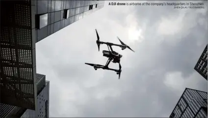  ??  ?? A DJI drone is airborne at the company’s headquarte­rs in Shenzhen.