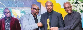  ?? ?? Chairman of Edo Sports Commission, Yussuf Alli ( second right), receiving the SportsVill­e award from the pair of Segun Odegbami ( right) and former Sports Minister, Sunday Dare while Award initiator, Frank Ilaboya (left) looks on with interests
