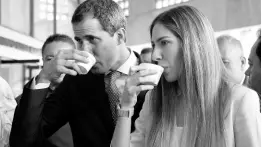  ?? AP ?? Venezuela’s opposition leader and self-proclaimed interim president Juan Guaidó and his wife, Fabiana Rosales, drink coffee during a congress of agricultur­al producers in Caracas, Venezuela, on Wednesday, August 14.