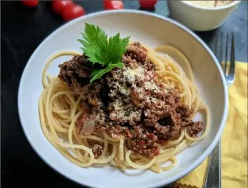  ?? Gretchen McKay/Post-Gazette ?? Pasta with a quick-to-prepare Bolognese sauce is perfect for busy school nights.