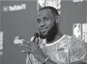  ?? AP Photo/Carlos Osorio ?? RELAXED, RESIGNED. Cleveland Cavaliers forward LeBron James, relaxed and even resigned to his fate, takes questions at a press conference after the basketball team's practice during the NBA Finals, Thursday, June 7, 2018, in Clweveland. The Warriors...