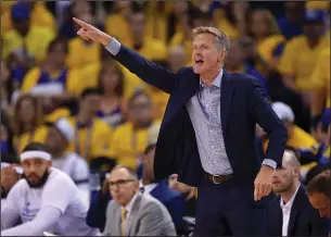  ?? JOSE CARLOS FAJARDO/TRIBUNE NEWS SERVICE ?? Golden State Warriors head coach Steve Kerr gestures to his team while playing the Cleveland Cavaliers during the first quarter of Game 2 of the NBA Finals on Sunday in Oakland, Calif.